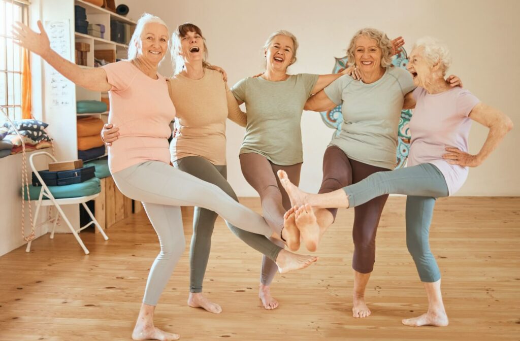 A group of happy older adults enjoying the social benefits of living in a rental senior community.